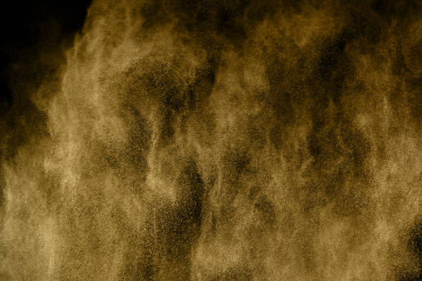 istock Golden powder explosion on black background. Freeze motion. 1137110343