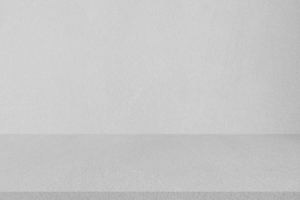 istock close up aged tan color  cement wall background texture with tile floor perspective plain for show or advertise or promote product and content on display 1137110348