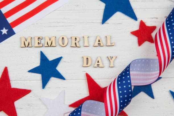 istock Text Memorial Day. Red and blue stars on worn white background 1137110356
