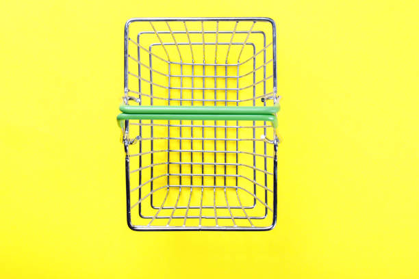 istock Shopping basket is empty on a bright yellow background. Conception Festive Sale Discount. Trading Supermarket Retail.Copy space .Top View. Flat Lay. 1137111439