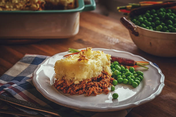 Preparing Traditional Shepard`s Pie in Domestic Kitchen