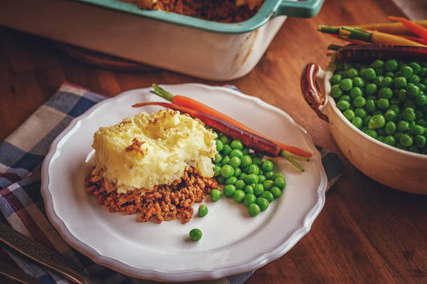 istock Preparing Traditional Shepard`s Pie in Domestic Kitchen 1137111873