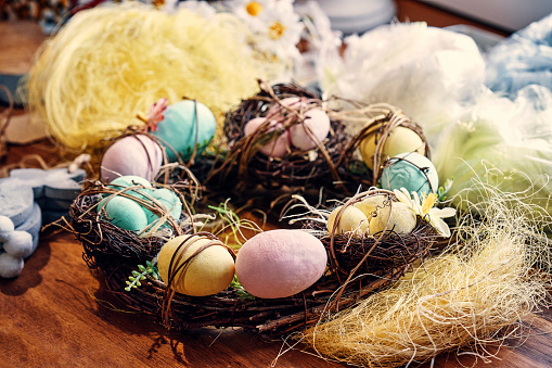 Decorated Easter Eggs Wreath on Rustic Background