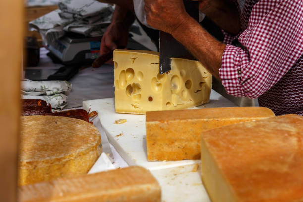 Small cheese pieces from San Simon conical cheeses, Lugo province, Galicia, Spain. Retail display in market stall.