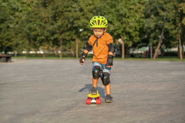 istock A little boy enjoys a yellow cruiser penny plastboard 1137114137