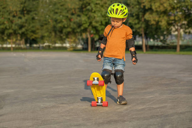 istock A little boy enjoys a yellow cruiser penny plastboard 1137114140