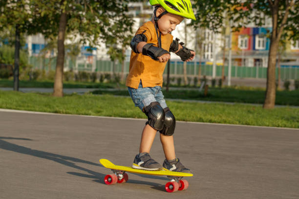 istock A little boy enjoys a yellow cruiser penny plastboard 1137114142