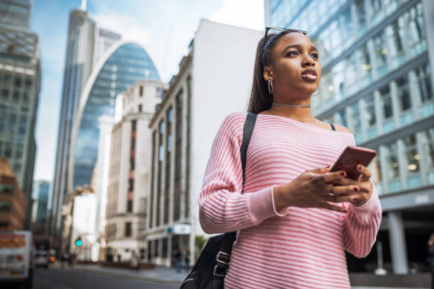 istock African woman in UK, using mobile app or GPS device. 1137115339