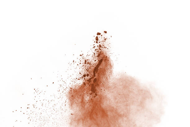 istock Brown color powder explosion on white background. Colored cloud. Colorful dust explode. Paint Holi. 1137116164