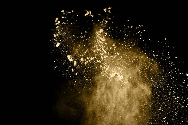 istock Golden powder explosion on black background. Freeze motion. 1137116173