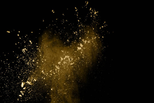 istock Golden powder explosion on black background. Freeze motion. 1137116189