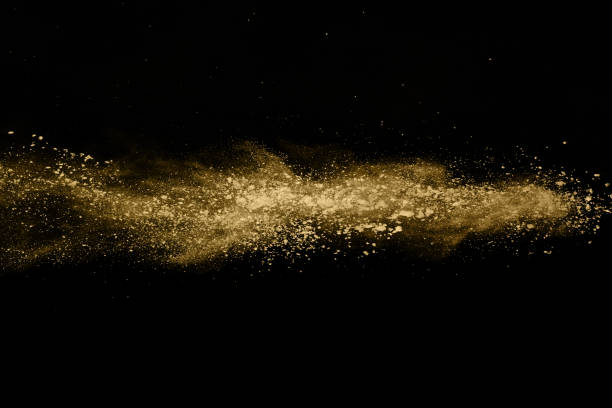 istock Golden powder explosion on black background. Freeze motion. 1137116192