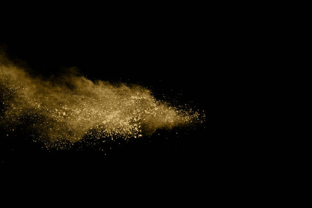 istock Golden powder explosion on black background. Freeze motion. 1137116222