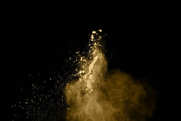 istock Golden powder explosion on black background. Freeze motion. 1137116295