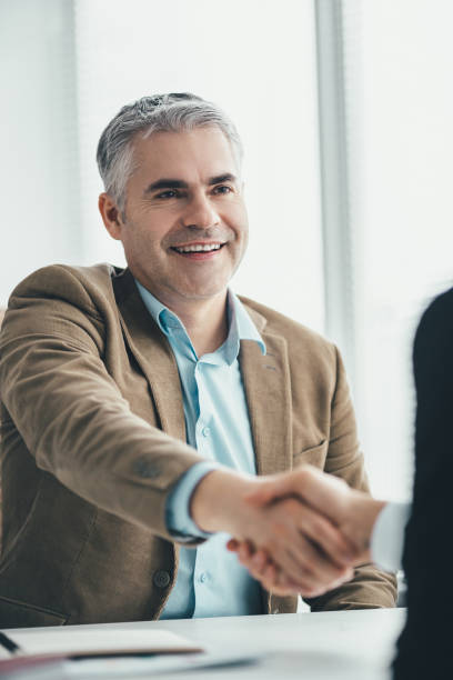 istock The two businessmen handshaking in the office 1137116750