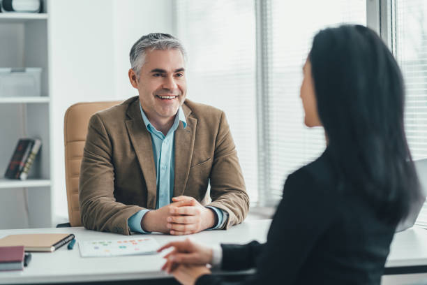 istock The two business people talking at the office table 1137119800