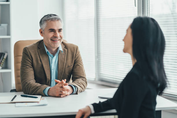 istock The two business people talking at the office table 1137119947
