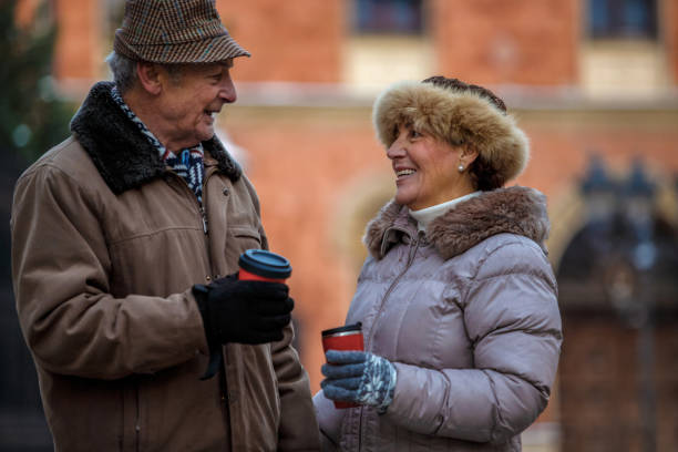 istock Smiling senior couple having coffee outdoors 1137123421