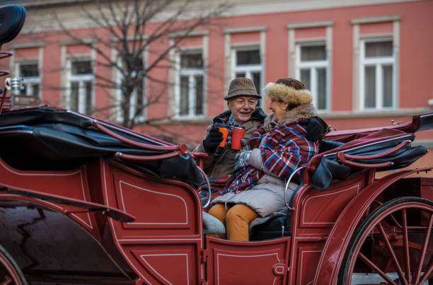 istock Senior couple enjoying romantic ride in a carriage 1137123688
