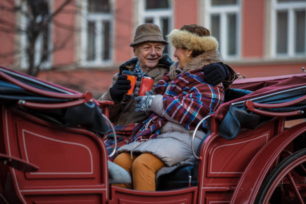 Senior couple enjoying romantic ride in a carriage