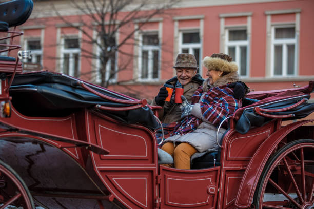 istock Senior couple enjoying romantic ride in a carriage 1137123700