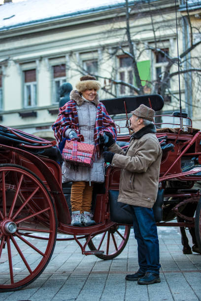istock Senior couple getting out of carriage 1137123710