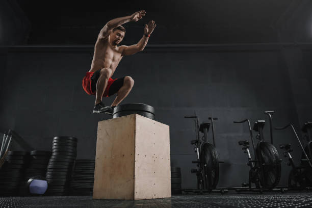 istock Athlete doing box jump exercise at the cross training gym 1137124045