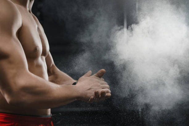 istock Muscular  athlete clapping hands and preparing for workout at the gym 1137124230