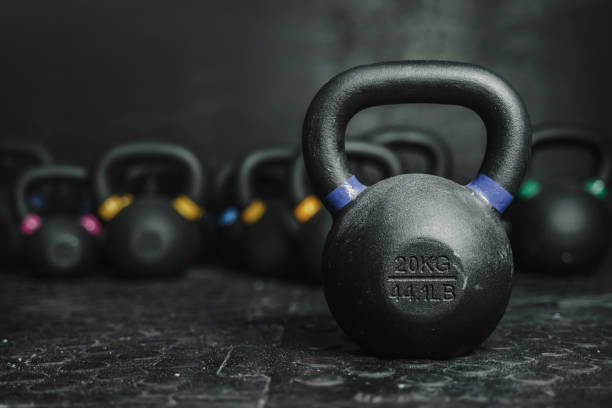 Kettlebells on dark backgroud at the gym gym Kettlebell equipment on dark backgroud at the gym gym. Sport concept. Copy space chin ups photos stock pictures, royalty-free photos & images