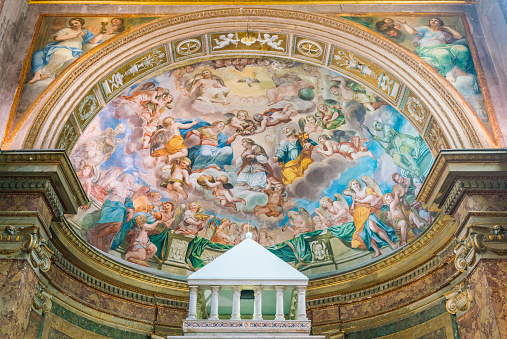 Valencia, Spain - April 8, 2023: Looking up at the painted ceiling inside the Church of Our Lady of the Forsaken cupola. There are no people on the scene.