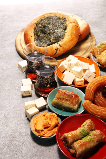 istock Middle eastern or arabic dishes and assorted meze, concrete rustic background. sambusak. Turkish Dessert Baklava with pistachio. Halal food. 1137125983