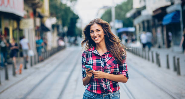 istock Happy woman using smart phone 1137130680