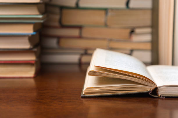 istock open book on the table against the background of books 1137132529