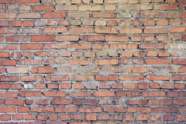 istock colored grunge brick wall background, tiled. brick wall of dark stone texture 1137134207