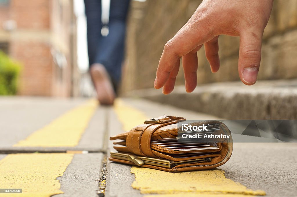 woman lost purse/wallet, walking away  Wallet Stock Photo