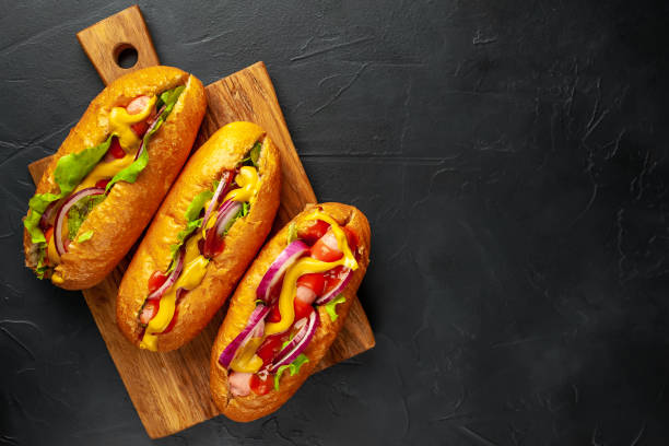 istock homemade hot dogs on concrete background, slate 1137138519