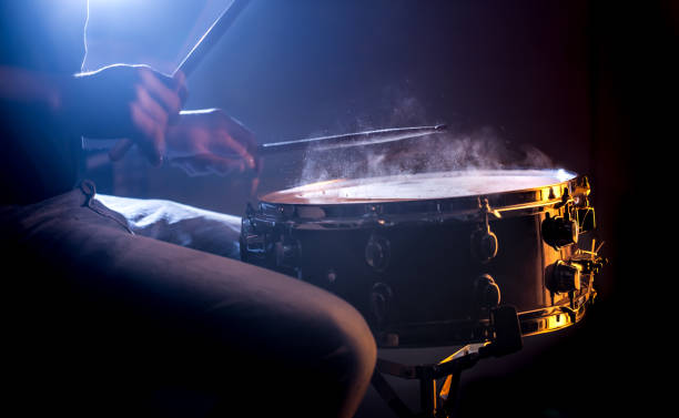 istock man playing the snare drum on a beautiful colored background 1137140705
