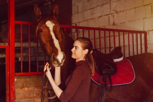 istock Young woman riding a horse 1137141191