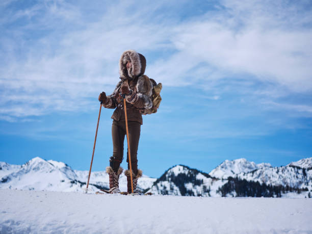 istock Woman Winter Snowshoeing Explorer 1137143775