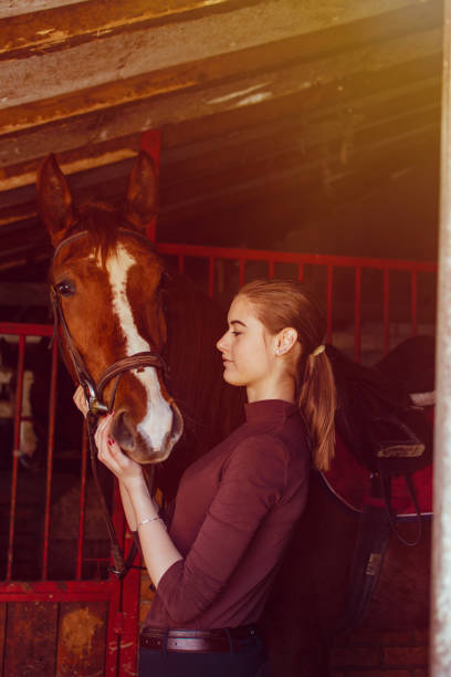 istock Young woman riding a horse 1137143931