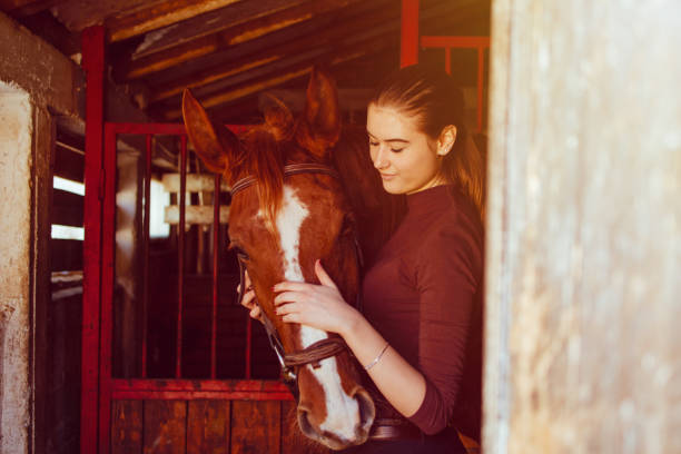 istock Young woman riding a horse 1137144397