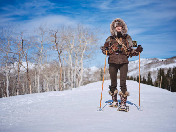 istock Woman Winter Snowshoeing Explorer 1137145515