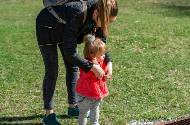 istock Mother and her child playing in a park 1137146711