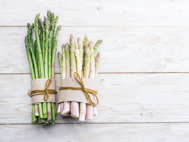 istock Green and white types of asparagus sprouts. 1137147944
