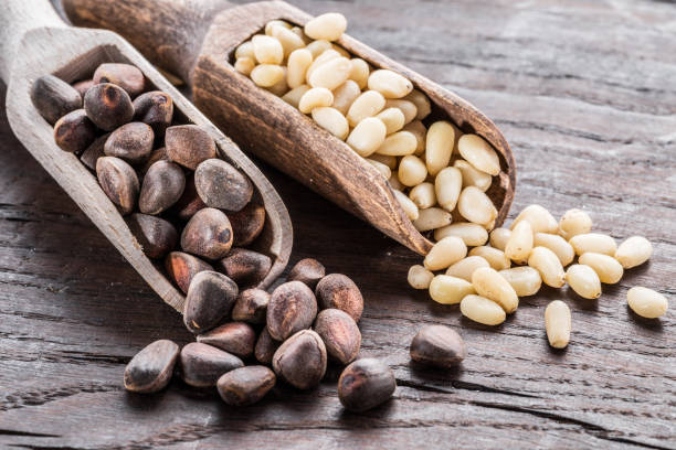 istock Pine nuts in the wooden scoops. 1137152071