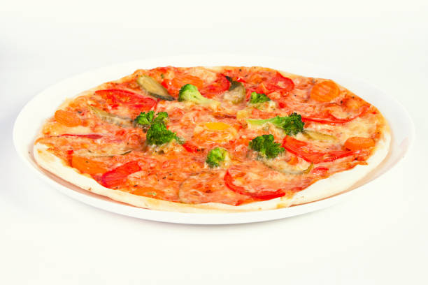 istock pizza with broccoli, tomatoes and vegetables on plate 1137161436