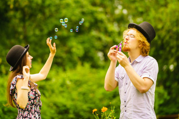 istock Couple blowing bubbles outdoor 1137161470