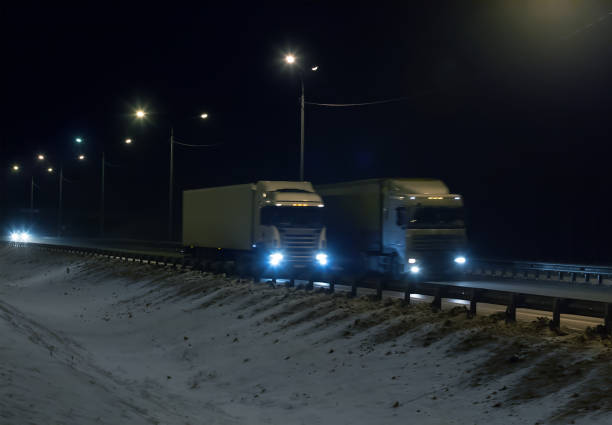 istock Trucks is moving along the winter road 1137162364