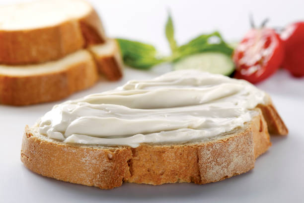 istock slice of bread with cream cheese (selective focus) 1137168769