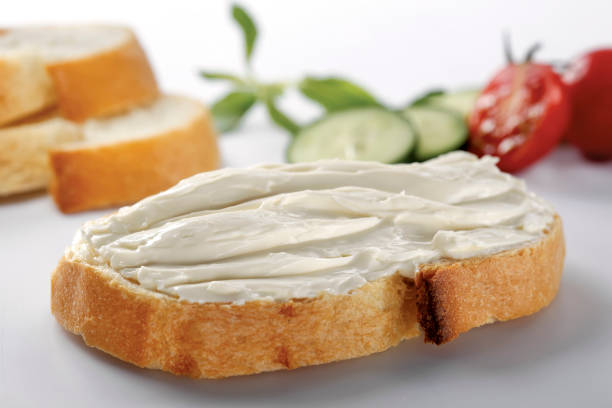 istock slice of bread with cream cheese (selective focus) 1137168813